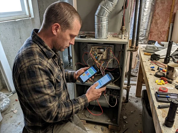 Two-stage furnace control board being verified against thermostat staging